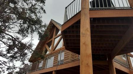 Custom deck wrap around deck with 10” log posts from Colorado Springs Deck Builder